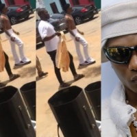 Wizkid spotted shirtless under hot sun within a neighborhood