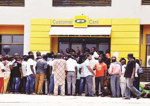 Nigerians storm telcos offices as MTN, GLO and others bar lines over NIN-SIM linkage